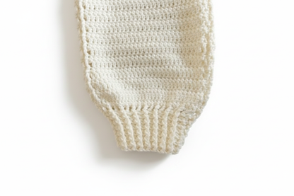 Sweater cuff detail on white background